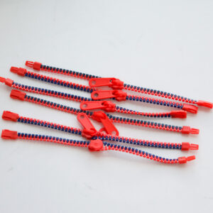 one side of the zipper is bright red and the other side navy blue