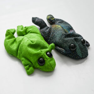2 mini handmade weighted frogs side by side. 1 green, 1 black