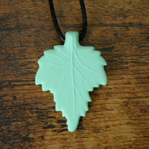 Mint green color leaf chew necklace. It has raised leaf veins for texture.