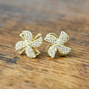 gold windmill shaped earrings covered in tiny sparkly rhinestones