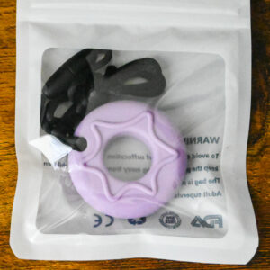 purple donut chew pendant inside the bag packaging