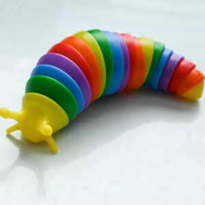 slug fidget with yellow head, rainbow body, yellow tail tip