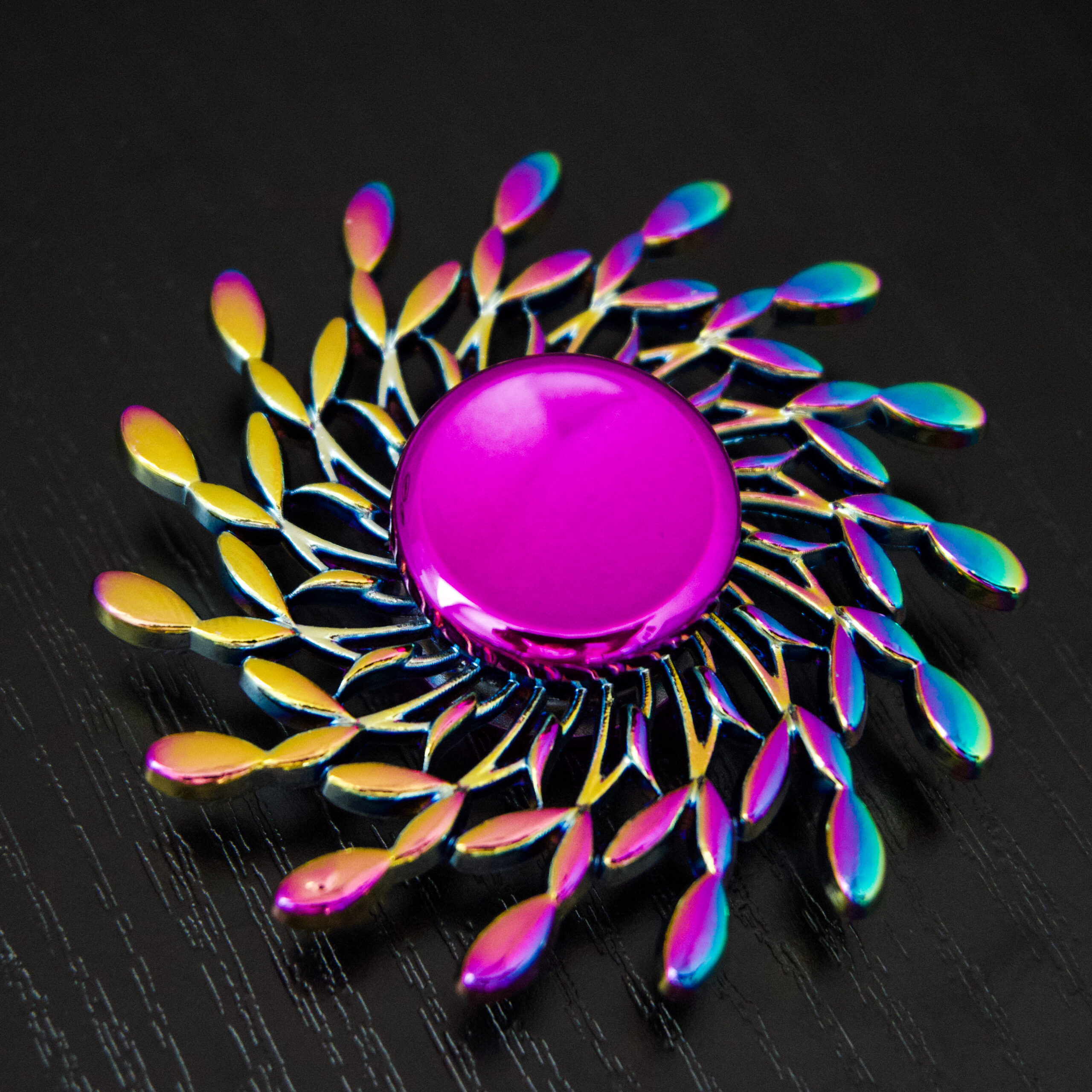 rainbow gradient spinner shaped like it's blowing in the wind