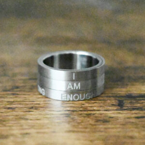 3 layers of the Affirmation Ring forming the statement "I am enough"