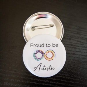 white background with an infinity symbol made up of multiple multicolored lines and the text "Proud to be Autistic"