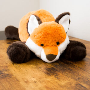 front of the fox plush face with it's 2 legs under it's chin
