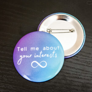 purple and blue gradient color background with the text "tell me about your special interests" in white and a white infinity symbol under that