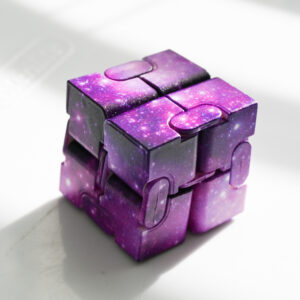 dark purple, purple, and speck of white for stars galaxy pattern in a thick block of light with a block of shadow and light