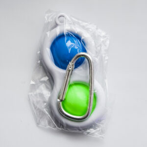 2 push bubbles 1 blue 1 green inside the packaging with a big key hook
