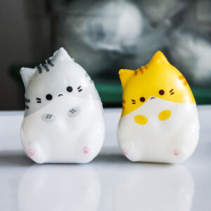 1 grey cat mini squishy, 1 orange cat mini squishy